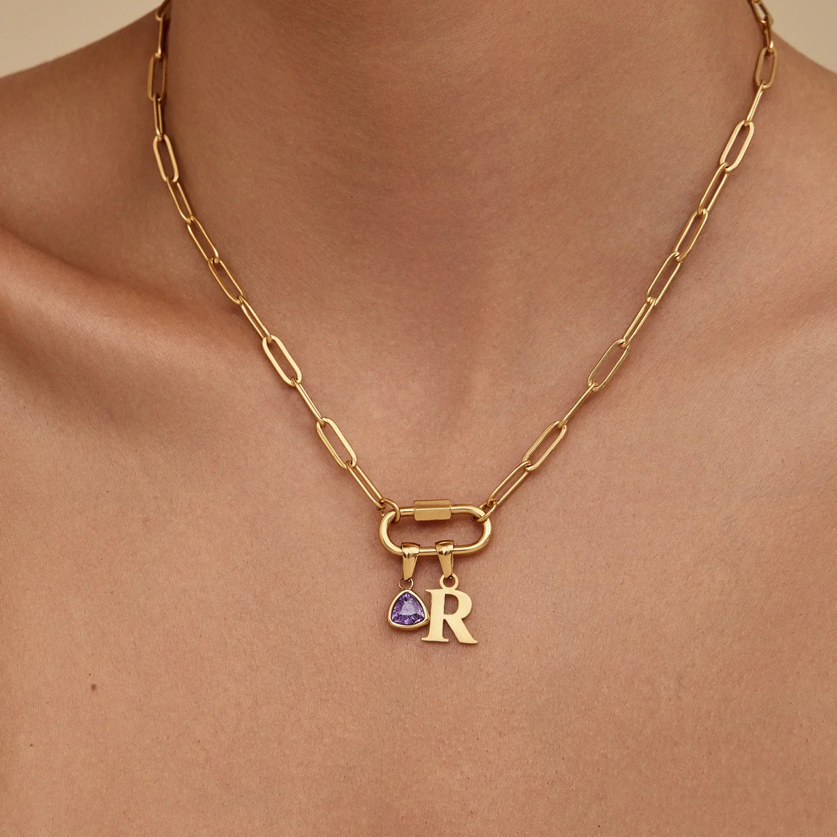 Carabiner initial birthstone necklace flat lay — Olivia Jewelry